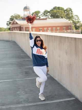 an auburn sweatshirt with navy and white color block perfect for fall football and war eagle fans shown with white pants