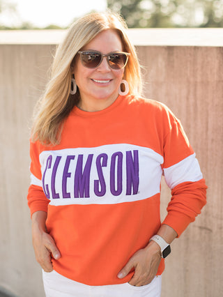 a clemson sweatshirt with orange and white color block perfect for fall football games and tiger pride