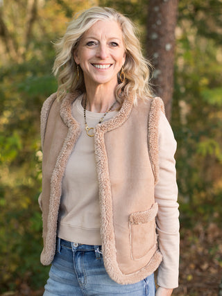 wear this tan sherpa vest in faux suede to holiday and christmas gatherings for a chic winter look