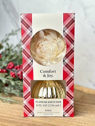 a festive gold flower diffuser with seasonal scents