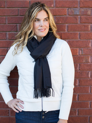 wear this black scarf with a fringe edge for a dash of drama or gift as a christmas present stocking stuffer