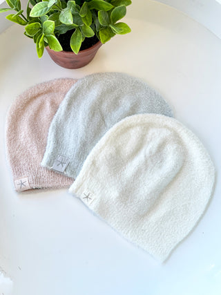 soft barefoot dream baby beanies in light colors