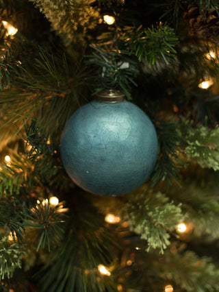 a textured blue green christmas tree ornament made from mercury glass perfect as a holiday hostess gift