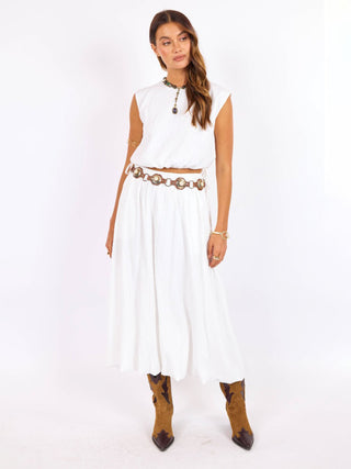 a breezy cap sleeve cropped top with side ties paired with a matching white maxi skirt