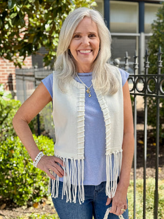  cream open vest with fringe and line detailing