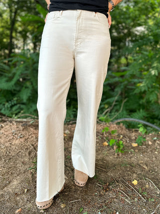 a pair of wide leg ivory pants with a super high rise comfort fit perfect for everyday wear