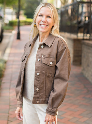 a light brown shacket with silver buttons and a relaxed silhouette perfect for fall fashion layering