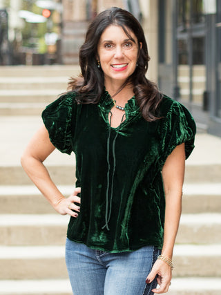 wear this emerald green velvet top with puff sleeves to christmas holiday parties as a feminine winter outfit