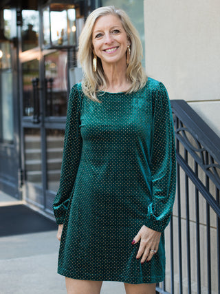 wear this emerald green velvet dress with tiny gold patterns to holiday and christmas parties