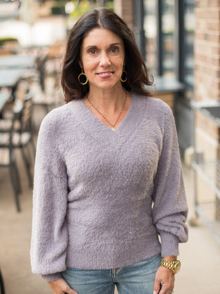 a lilic fuzzy velvet sweater with long statement sleeves and a v neckline perfect for luxurious cold weather fashion