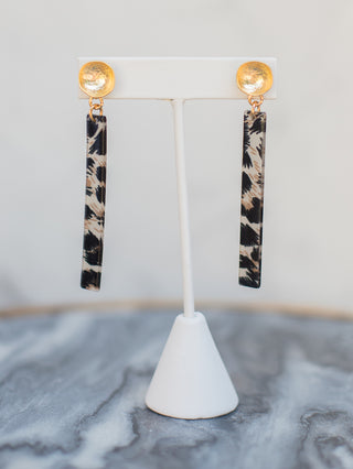 a pair of lightweight tortoise shell bar dangle earrings with gold perfect for everyday jewelry wear