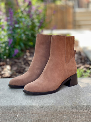 a pair of waterproof brown suede boots with a comfort block heel perfect for fashionable everyday wear