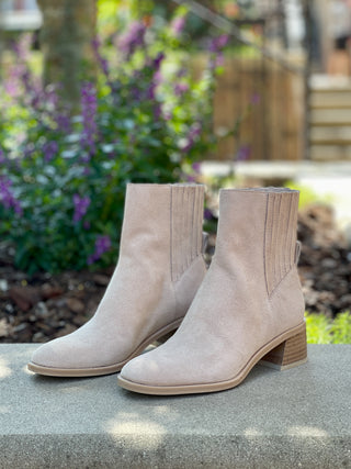 a pair of waterproof beige suede boots with a comfort block heel perfect for fashionable everyday wear