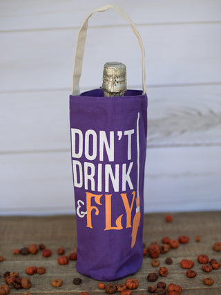 a purple halloween witch themed wine bag that reads dont drink and fly perfect for spooky season gifts