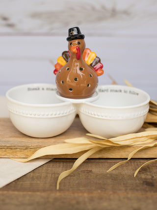 a white double dish for dip that reads sneak a snack and hard snack to follow for thanksgiving shown with a turkey sitter