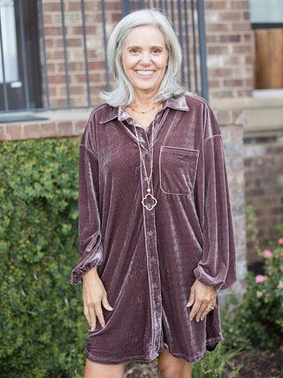 a dark purple shirt dress in velvet with buttons down the front and long statement sleeves made for a cozy fall