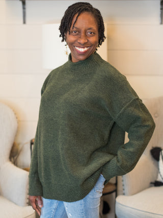 a forest green mock turtleneck oversized sweater perfect for layering and fall fashion