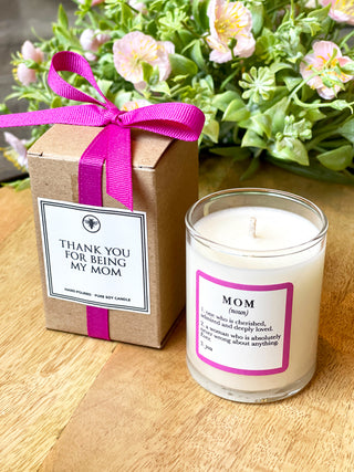 coconut sugar and sandalwood soy candle with mom definition on glass and gift box