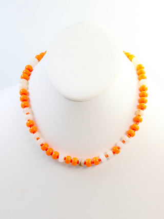 white and orange beaded necklace