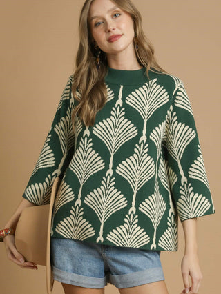 green and white leaf patterned sweater with half sleeves and crew neck