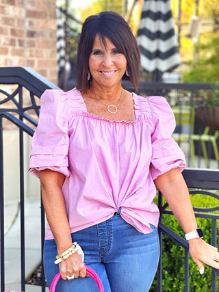 puffy pink top with square neckline and ruffled sleeves