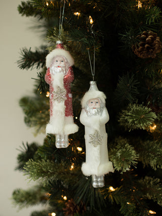 a vintage santa claus figurine christmas tree ornament with glitter and sparkling snowflakes great as holiday host gift