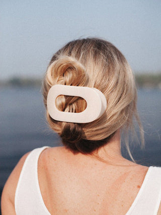 beige teleties hair clip used to hold hair up and add style
