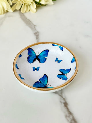 a charming blue butterfly jewelry dish with a gold rim