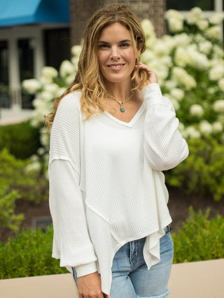 an oversize ivory waffle knit top with long sleeves and a v neck perfect for your loungewear collection