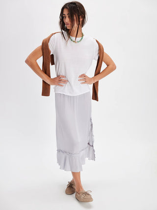 a sleek ivory white capped sleeve tee worn with a gray midi skirt