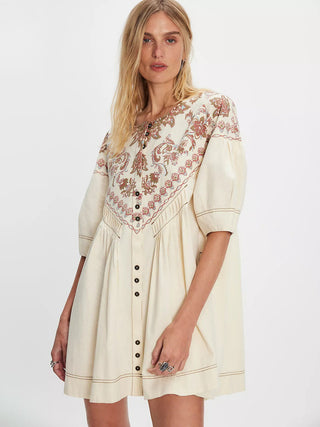 cream colored mini dress with floral embroidery