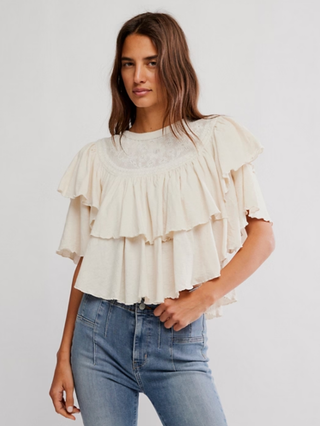 cream ruffled blouse with lace details