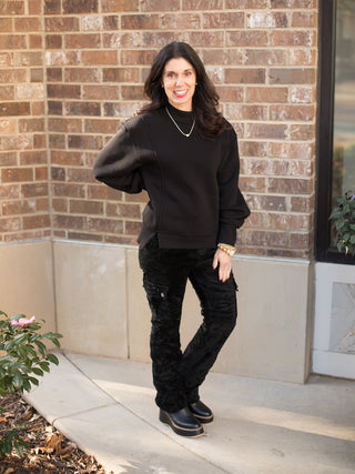 wear this relaxed fit black sweater with a mock turtleneck and extra long sleeves with black velvet cargo pants