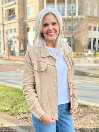 a lightweight earth beige linen jacket with a fringe hem and pockets