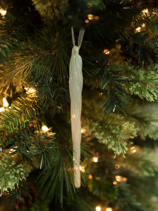 a blown glass icicle christmas ornament for minimal tree decorations and great as holiday host gifts