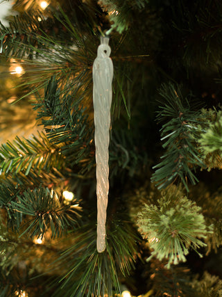 a blown glass icicle christmas ornament for minimal tree decorations and great as holiday host gifts