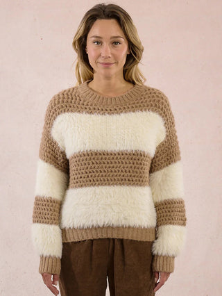 a cozy fur and open knit sweater with beige and white stripes