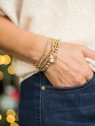 wear these gold stacked beaded bracelets with statement crystal for everyday glam and as stocking stuffers and holiday gifts