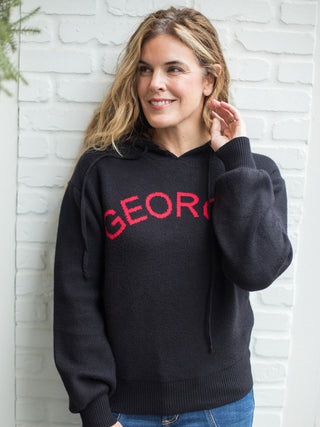 wear this black hoodie sweater with georgia written across the chest in red to uga bulldogs gameday parties and stadiums