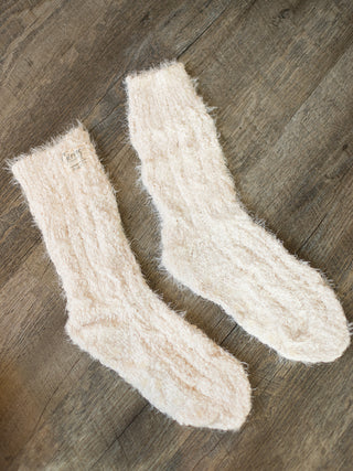 gift these fuzzy off white giving socks this holiday season for the host or as christmas stocking stuffers