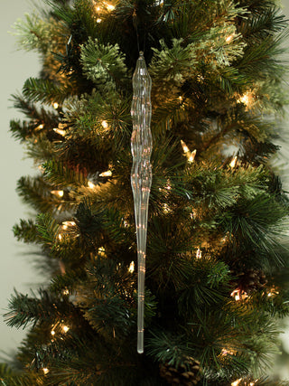 a classic statement glass christmas tree ornament in the shape of an icicle made to reflect light great for holiday host gift