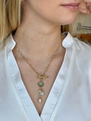 gold chain necklace with gold toggle teal teardrop crystal a pearl bead a vibrant turquoise bead