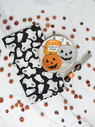 a three piece halloween serving set with a ghost napkin pumpkin dish and matching stainless steel spreader