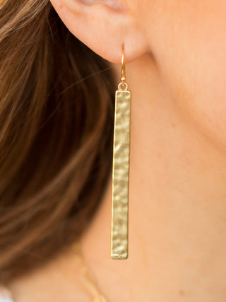 lightweight simple gold hammered bar earrings with a fishhook back 