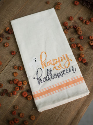 a cream orange and black hand towel that reads happy halloween perfect for fall decor gifts