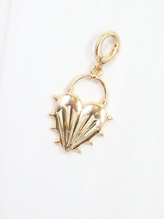 gold heart charm with spike textured details