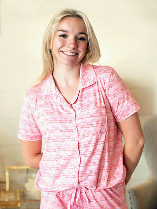 pink sleep shirt with heart patterns and short sleeves for valentines day with matching sleep pants