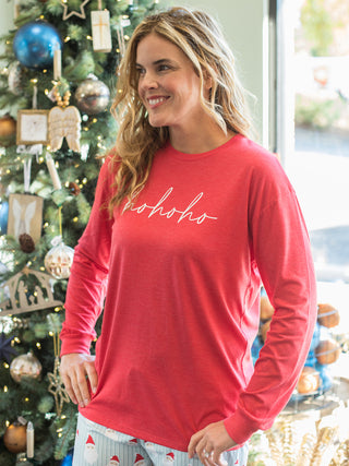 wear this red long sleeve long top that reads ho ho ho in cursive script on christmas morning with pajama pants