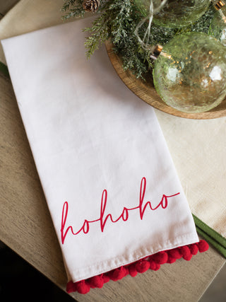 place this festive white and red tea towel that reads ho ho ho in your home as holiday decor or give as a hostess gift
