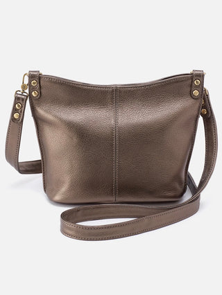 a metallic bronze leather crossbody purse with a magnetic closure and gold accents